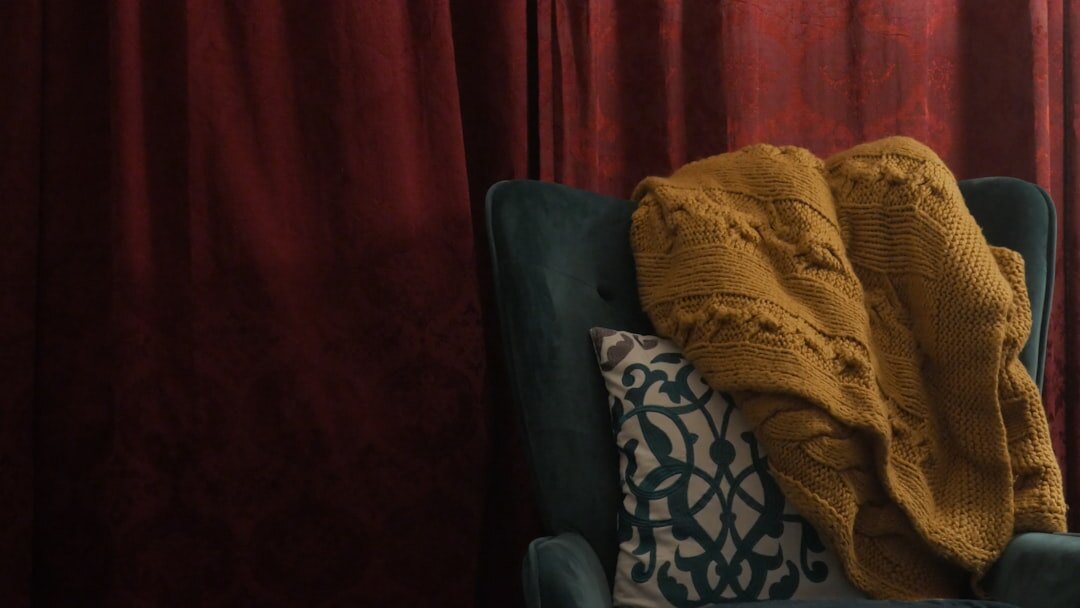 open detective novel on cozy chair