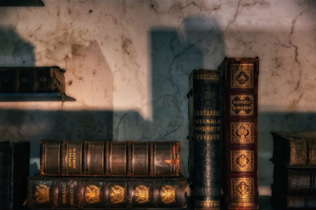 Close up of aged book spines on a shelf
